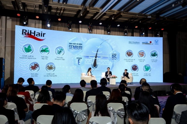 A group of people sitting in chairs in front of a large screenAI-generated content may be incorrect.